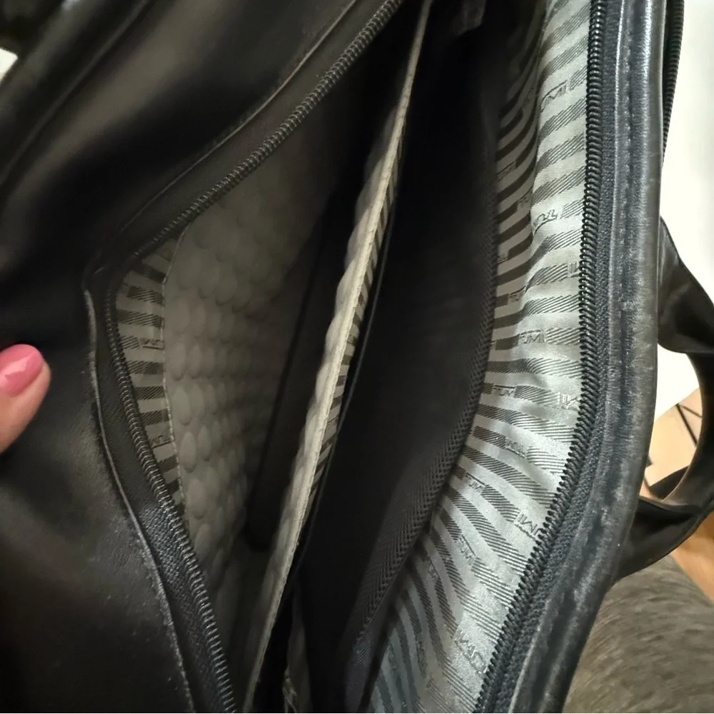 Tumi black leather